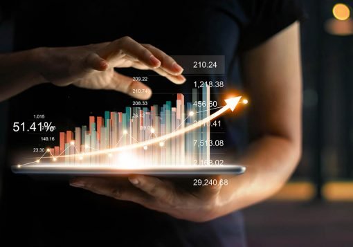 Businessman holding tablet and showing a growing virtual hologram of statistics, graph and chart with arrow up on dark background. Stock market. Business growth, planing and strategy concept.